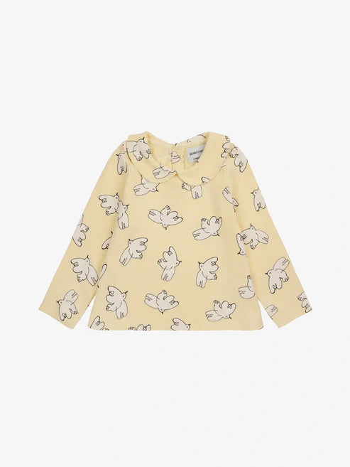 Der T-Shirt „Freedom Bird“ lädt Babys zum Träumen und Entdecken ein.