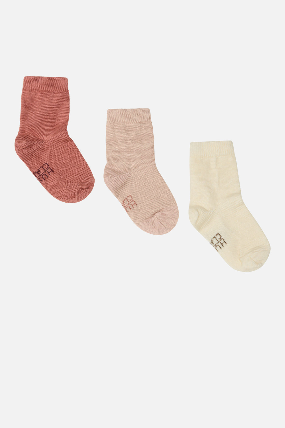 Klassischer Socken mit einem Hust&amp;Claire-Logo unter dem Fuß von Hust &amp; Claire Die Socken haben innen Bambus-Viskose und außen Wolle.