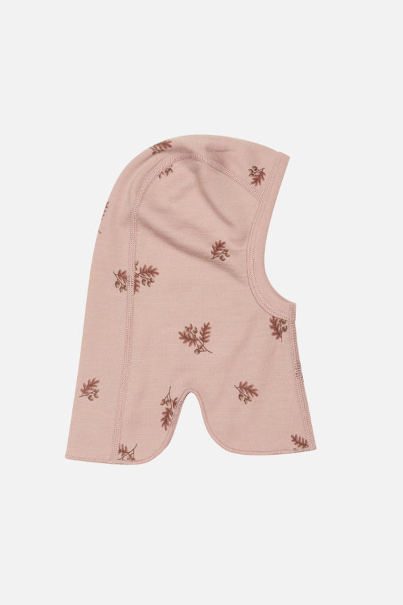 Schöne Schalmütze von Hust and Claire mit Muster in rosa. Sie besteht aus weicher, dehnbarer Bambusviskose und Wolle 