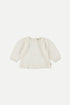 Bluse aus weicher Musselin mit langen Ärmel, Rundhalsausschnitt und geraffte Details vorne und an den Schultern.